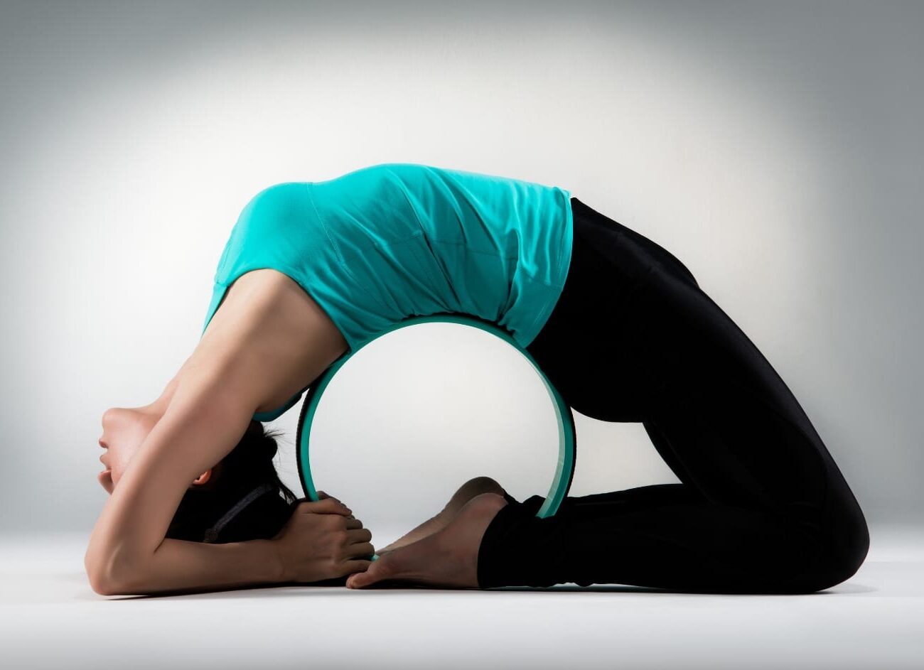 Develop more confidence for advanced yoga postures using the CAPEZIO Yoga Wheel