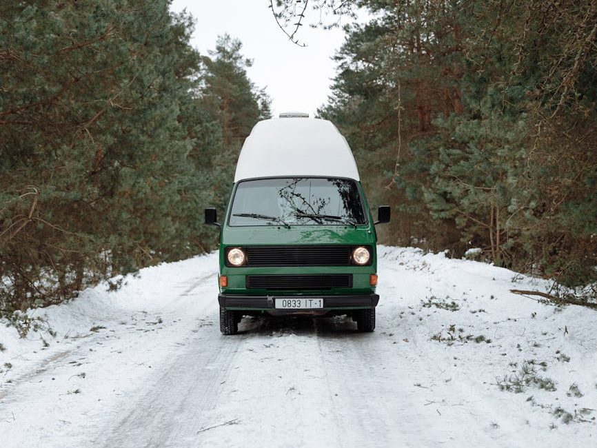 a campervan on a snow covered road